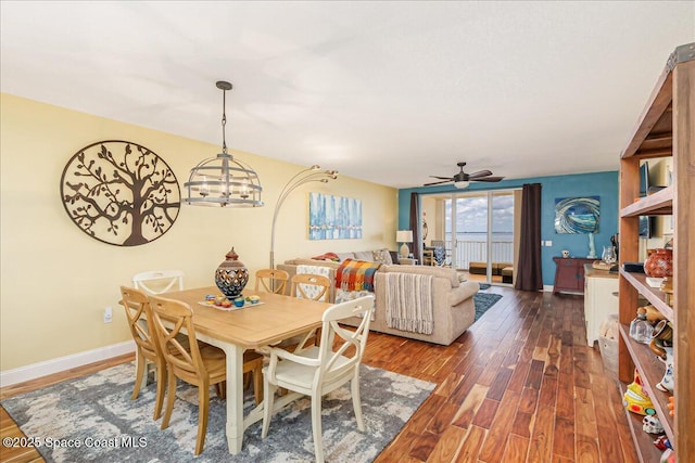 7008 Sevilla Ct Ph 505, Cape Canaveral, FL 32920 - dining space with dark wood-style flooring, ceiling fan, and baseboards