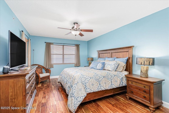 7008 Sevilla Ct Ph 505, Cape Canaveral, FL 32920 - bedroom featuring wood finished floors, baseboards, and a ceiling fan