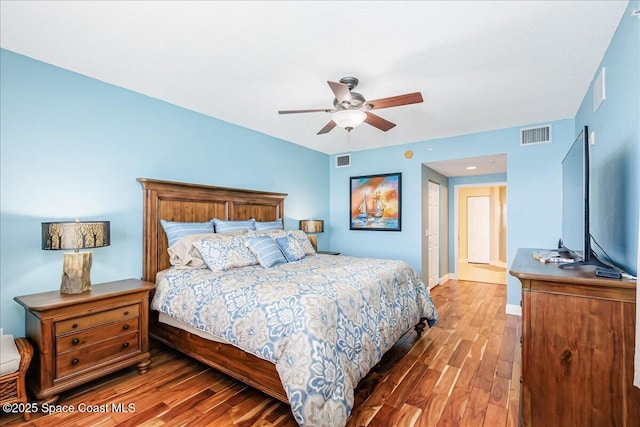 7008 Sevilla Ct Ph 505, Cape Canaveral, FL 32920 - bedroom with wood finished floors, baseboards, and ceiling fan