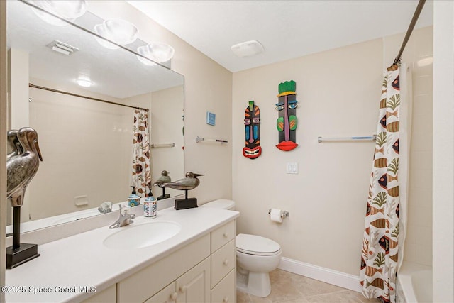7008 Sevilla Ct Ph 505, Cape Canaveral, FL 32920 - bathroom featuring toilet, tile patterned floors, baseboards, and vanity
