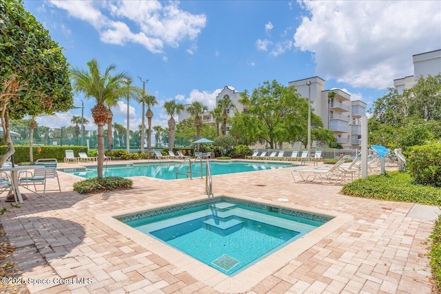 7008 Sevilla Ct Ph 505, Cape Canaveral, FL 32920 - community pool with a community hot tub, a patio area, and fence