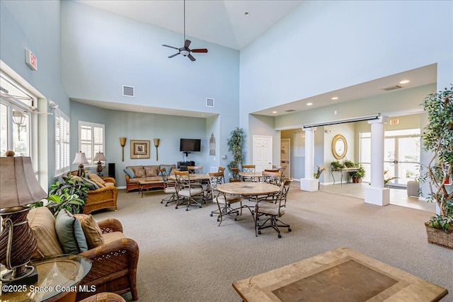 7008 Sevilla Ct Ph 505, Cape Canaveral, FL 32920 - carpeted dining room featuring a towering ceiling, plenty of natural light, decorative columns, ceiling fan, and recessed lighting