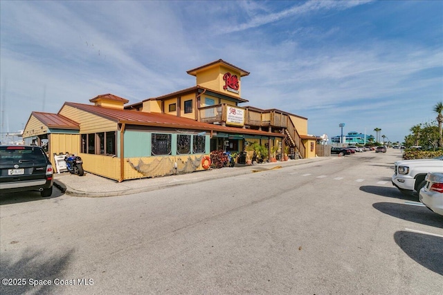 7008 Sevilla Ct Ph 505, Cape Canaveral, FL 32920 - view of building exterior featuring stairs