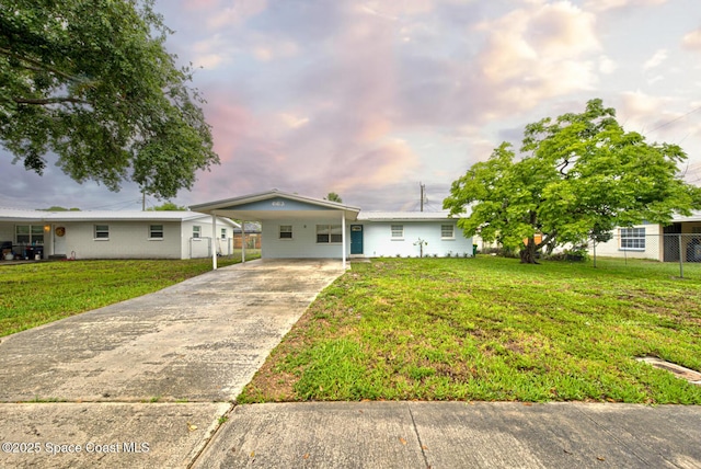 663 Bacon St, Cocoa, FL 32926 - ranch-style home featuring concrete driveway and an attached carport