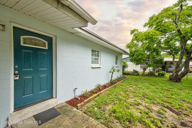 663 Bacon St, Cocoa, FL 32926 - doorway to property featuring concrete block siding