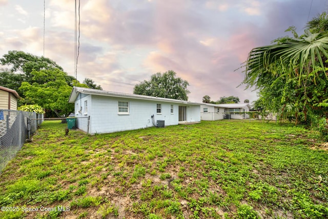 663 Bacon St, Cocoa, FL 32926 - rear view of property featuring central AC unit and concrete block siding