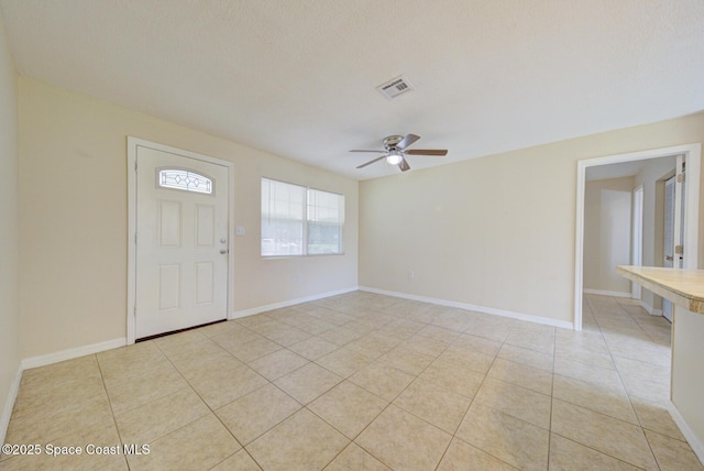 663 Bacon St, Cocoa, FL 32926 - foyer featuring a ceiling fan, light tile patterned floors, and baseboards