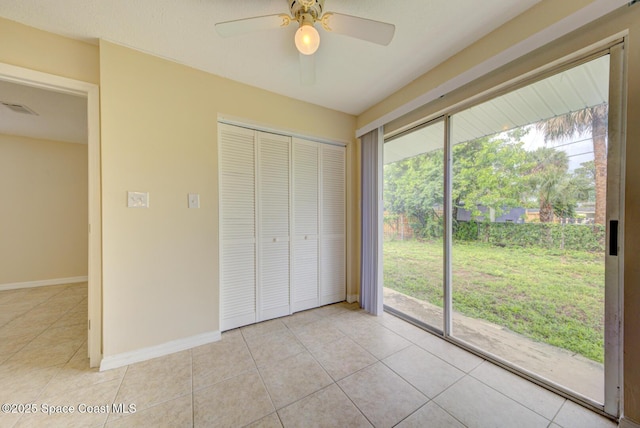 663 Bacon St, Cocoa, FL 32926 - unfurnished bedroom with light tile patterned floors, a closet, and baseboards