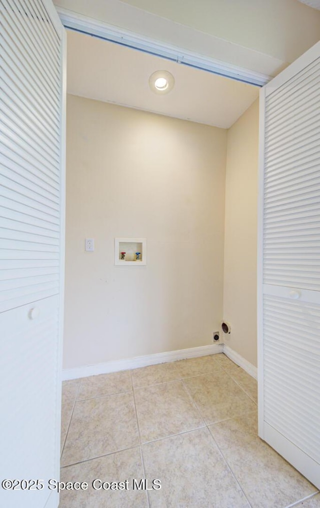 663 Bacon St, Cocoa, FL 32926 - washroom with hookup for a washing machine, light tile patterned floors, and baseboards