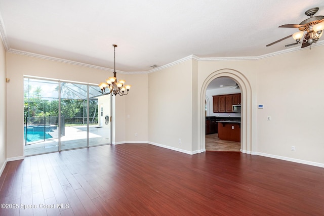 unfurnished room with a ceiling fan, dark wood-style flooring, baseboards, a chandelier, and ornamental molding