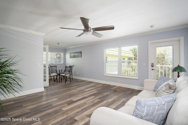 44 Vista Gardens Trl Unit 206, Vero Beach, FL 32962 - living area with ornamental molding, a ceiling fan, wood finished floors, healthy amount of natural light, and a textured ceiling
