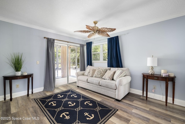 44 Vista Gardens Trl Unit 206, Vero Beach, FL 32962 - living area with wood finished floors, ornamental molding, a ceiling fan, and baseboards