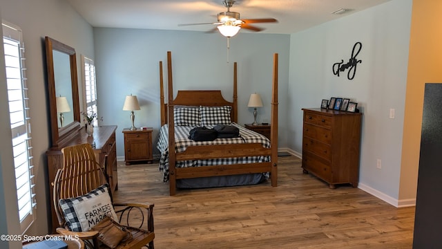 451 Dillard Dr SE, Palm Bay, FL 32909 - bedroom featuring wood finished floors, baseboards, and ceiling fan