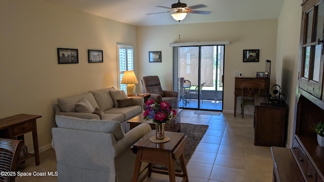 451 Dillard Dr SE, Palm Bay, FL 32909 - living area with a ceiling fan, light tile patterned floors, and baseboards