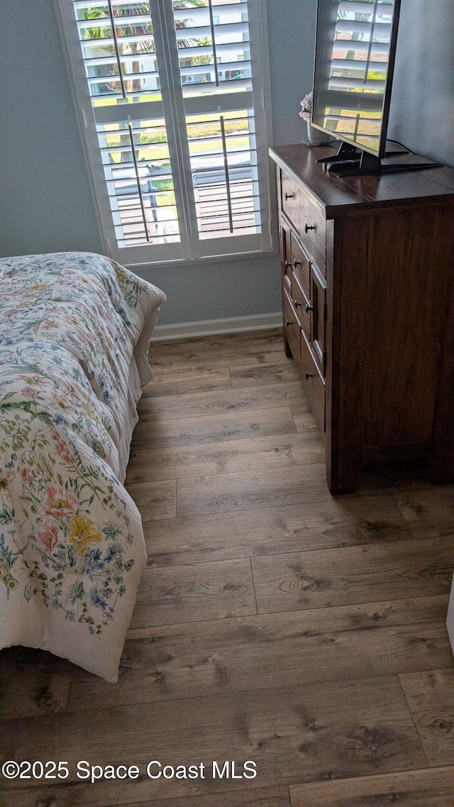 451 Dillard Dr SE, Palm Bay, FL 32909 - bedroom featuring dark wood-type flooring and baseboards