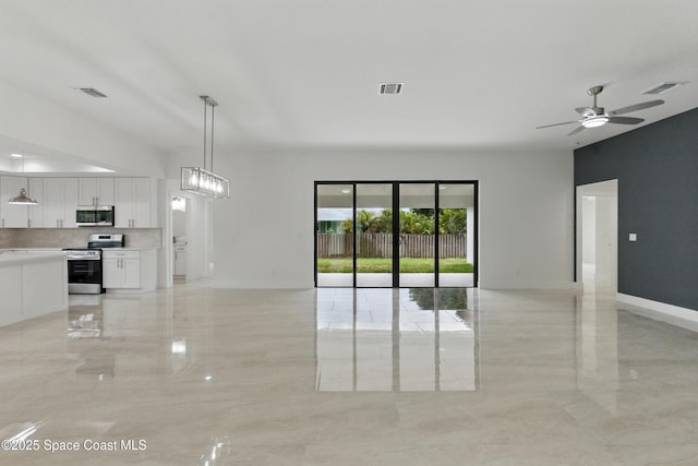 6002 Myrtle Dr, Ft Pierce, FL 34982 - empty room featuring light marble finish floors, baseboards, and a ceiling fan
