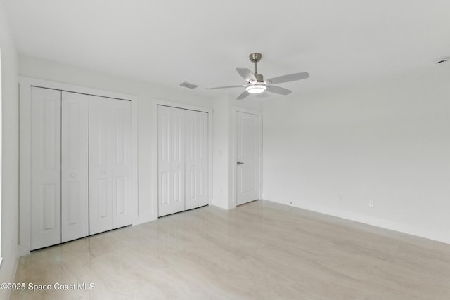 6002 Myrtle Dr, Ft Pierce, FL 34982 - unfurnished bedroom featuring multiple closets, baseboards, and ceiling fan