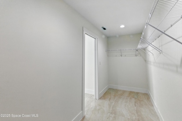 6002 Myrtle Dr, Ft Pierce, FL 34982 - walk in closet featuring light wood-type flooring