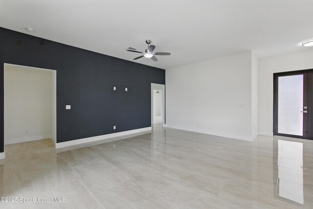 6002 Myrtle Dr, Ft Pierce, FL 34982 - spare room with ceiling fan, a smoke detector, and baseboards