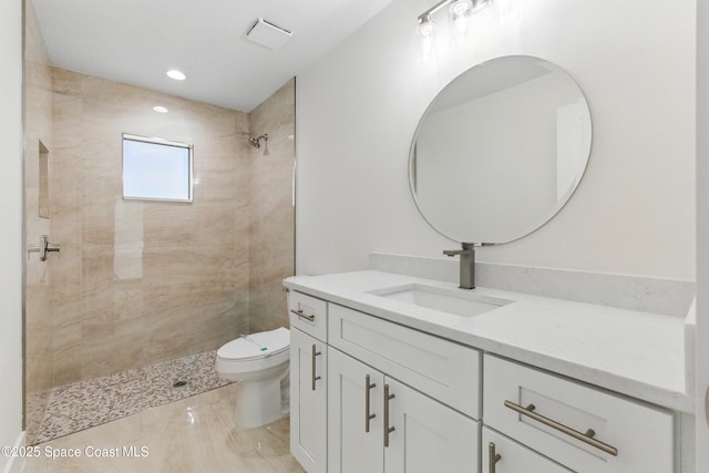 6002 Myrtle Dr, Ft Pierce, FL 34982 - bathroom with toilet, vanity, a tile shower, and recessed lighting
