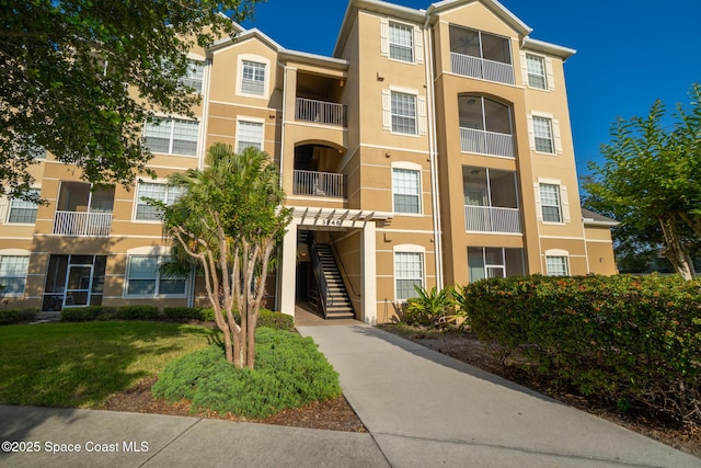 3848 Lexmark Ln Unit 307, Rockledge, FL 32955 - view of apartment building / complex with stairway