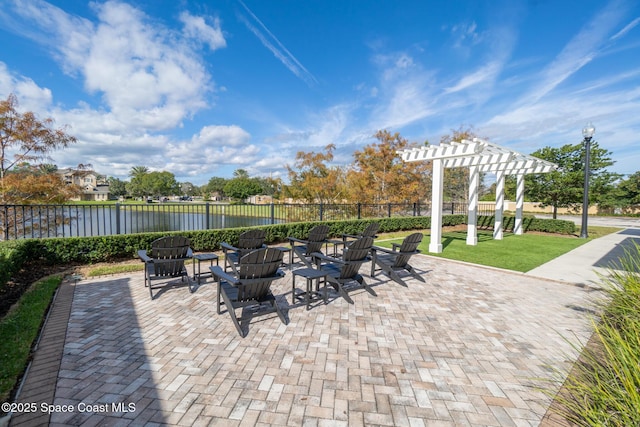 3848 Lexmark Ln Unit 307, Rockledge, FL 32955 - view of patio with a water view, a pergola, and an outdoor fire pit