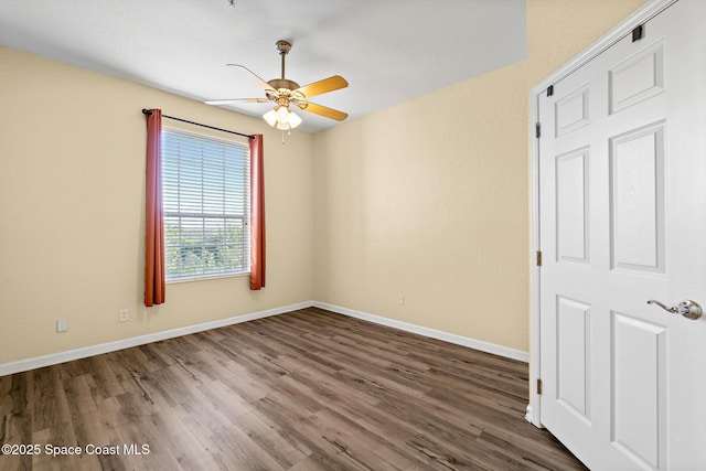 3848 Lexmark Ln Unit 307, Rockledge, FL 32955 - unfurnished room with a ceiling fan, wood finished floors, and baseboards