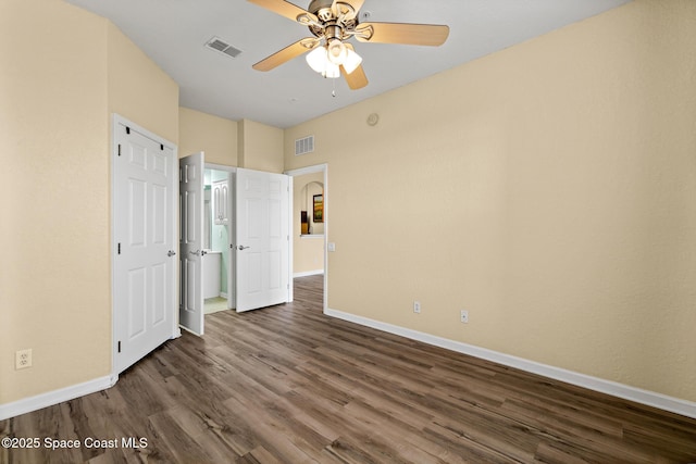 3848 Lexmark Ln Unit 307, Rockledge, FL 32955 - unfurnished bedroom featuring baseboards, dark wood-type flooring, and ceiling fan