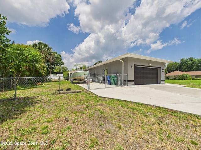 802 Clearmont St, Sebastian, FL 32958 - view of property exterior featuring driveway, an attached garage, stucco siding, and a gate