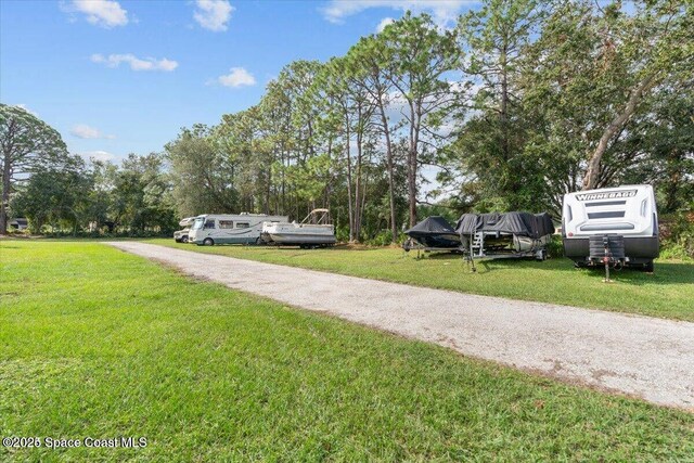4805 Valdine Ave, Cocoa, FL 32926 - view of grassy yard with view of wooded area