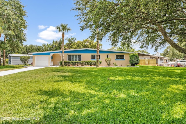 1303 Oxford Way, Cocoa, FL 32922 - ranch-style house featuring a garage, stucco siding, and concrete driveway