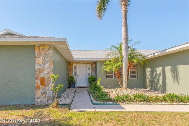 384 Pepper St NE, Palm Bay, FL 32907 - entrance to property with stucco siding and stone siding
