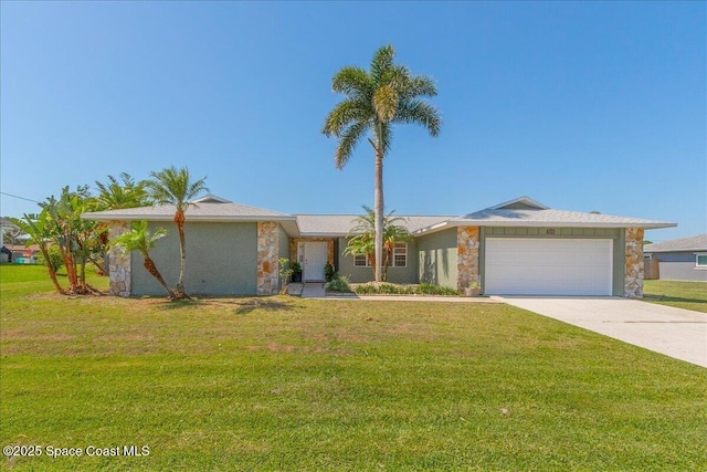 384 Pepper St NE, Palm Bay, FL 32907 - view of front of home with stone siding, an attached garage, concrete driveway, and a front yard
