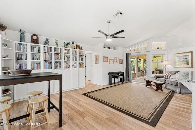 722 Hyannie St NE, Palm Bay, FL 32907 - living room with wood finished floors, ceiling fan, and vaulted ceiling