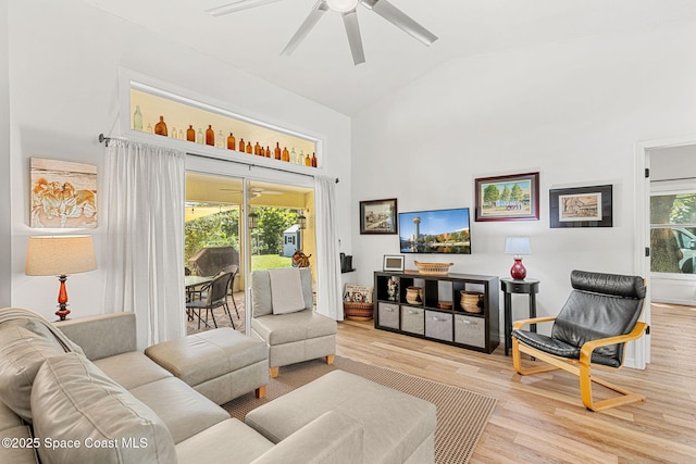 722 Hyannie St NE, Palm Bay, FL 32907 - living room featuring high vaulted ceiling, a ceiling fan, and wood finished floors