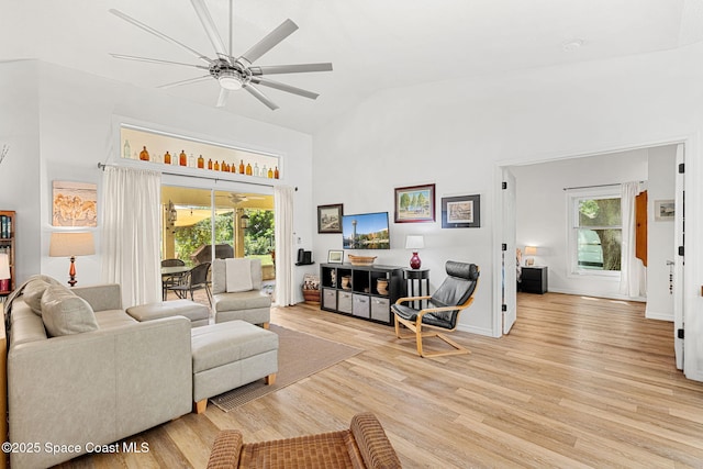 722 Hyannie St NE, Palm Bay, FL 32907 - living area with ceiling fan, light wood-style floors, and high vaulted ceiling