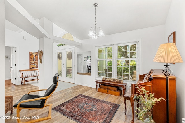 722 Hyannie St NE, Palm Bay, FL 32907 - home office with a chandelier, wood finished floors, and high vaulted ceiling