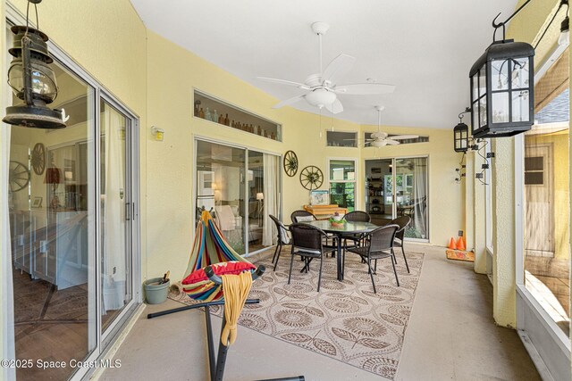 722 Hyannie St NE, Palm Bay, FL 32907 - sunroom with a ceiling fan, outdoor dining area, and vaulted ceiling
