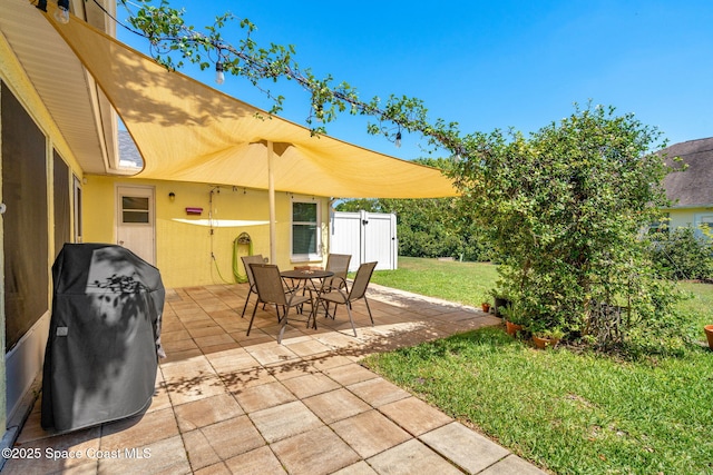 722 Hyannie St NE, Palm Bay, FL 32907 - view of patio with outdoor dining area and a grill