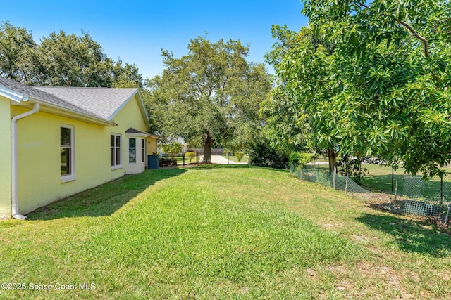 722 Hyannie St NE, Palm Bay, FL 32907 - view of yard featuring central air condition unit