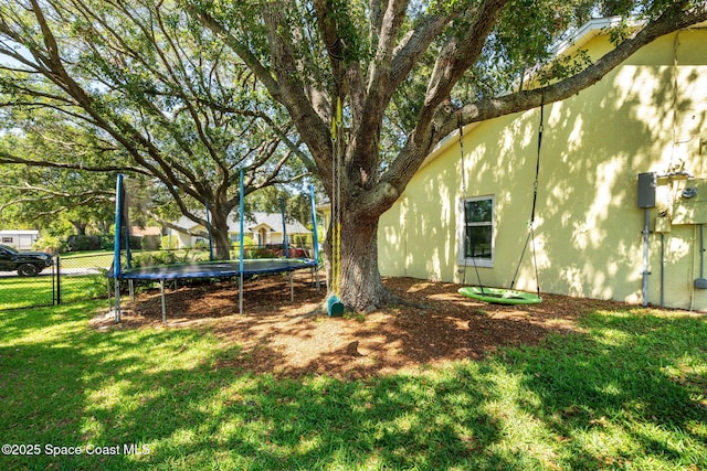 722 Hyannie St NE, Palm Bay, FL 32907 - view of yard with a trampoline