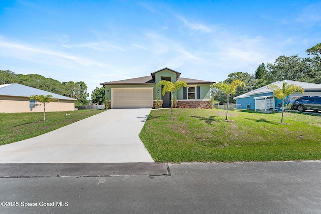 563 Holmes Ave NW, Palm Bay, FL 32907 - view of front of property featuring an attached garage, concrete driveway, stone siding, a front yard, and stucco siding
