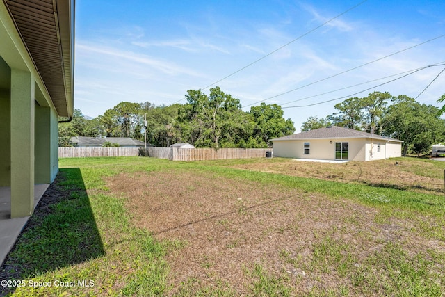 563 Holmes Ave NW, Palm Bay, FL 32907 - view of yard featuring fence