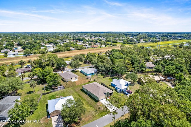 563 Holmes Ave NW, Palm Bay, FL 32907 - aerial view of residential area featuring a tree filled landscape