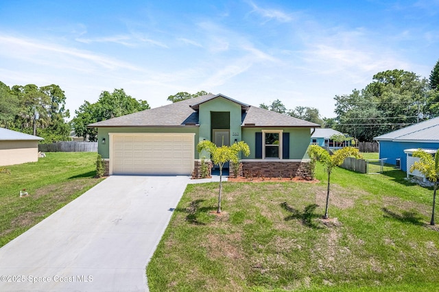 563 Holmes Ave NW, Palm Bay, FL 32907 - view of front of property with stone siding, a garage, driveway, and stucco siding
