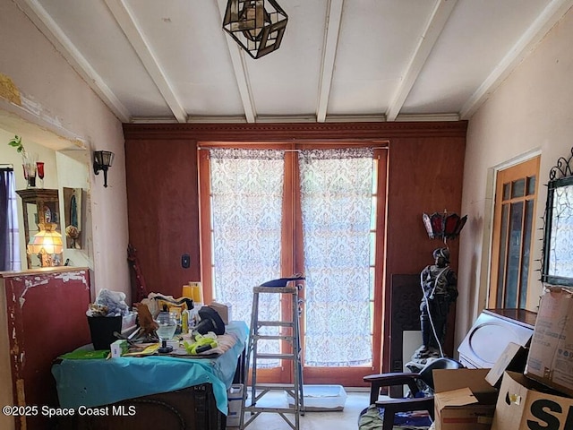 dining area with beamed ceiling