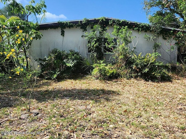 view of property exterior with stucco siding