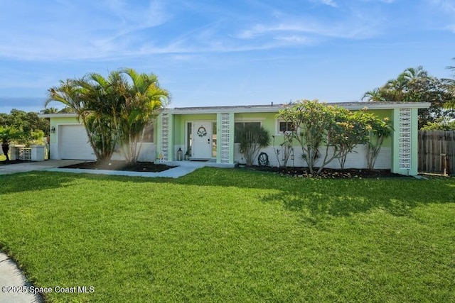 2160 Emerald Ct, Merritt Island, FL 32953 - view of front facade with driveway, a garage, and stucco siding