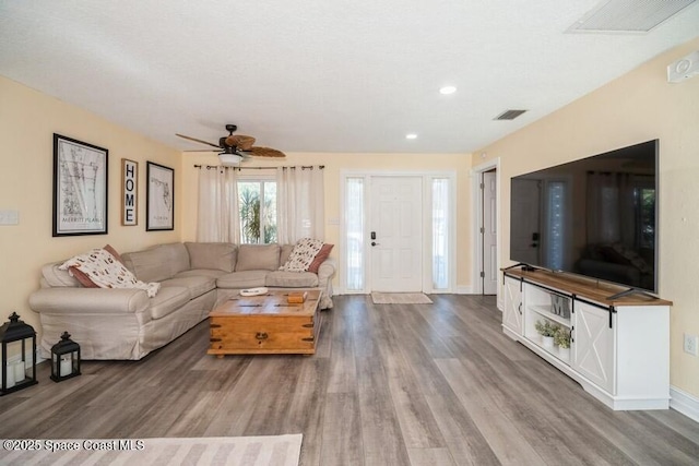 2160 Emerald Ct, Merritt Island, FL 32953 - living room featuring wood finished floors, a ceiling fan, baseboards, and recessed lighting