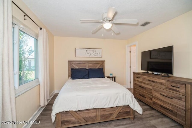 2160 Emerald Ct, Merritt Island, FL 32953 - bedroom with wood finished floors, baseboards, and ceiling fan